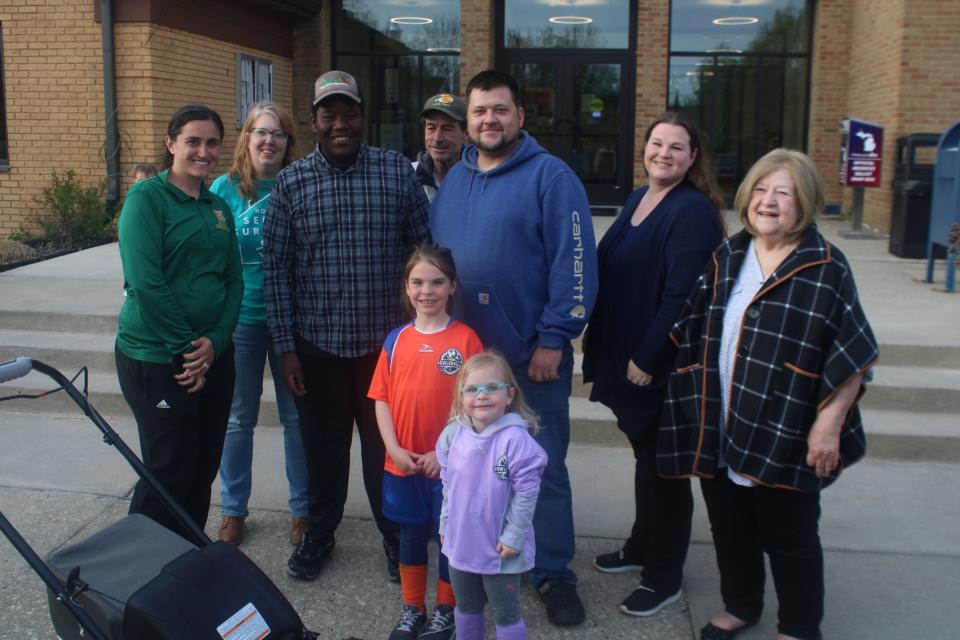 Treyvon Hoskins poses for a photo with his family Monday, April 22, outside Howell City Hall.