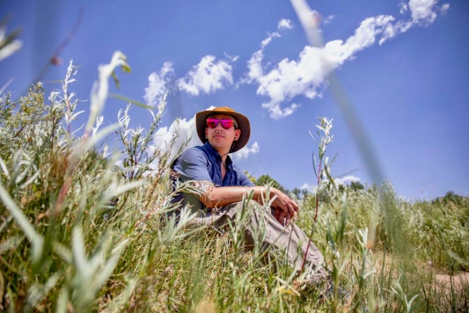 Wes Noe rests on the banks of the Rio Grande among coyote willow and salt cedar.