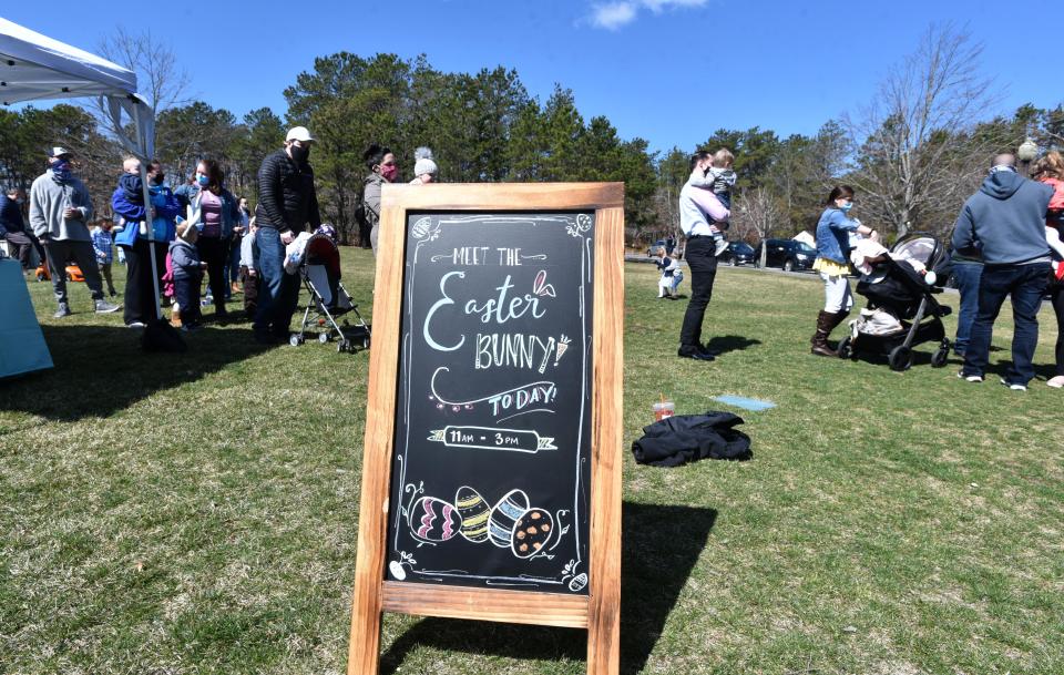 Children wait in line for a socially-distanced visit with the Easter Bunny in 2021 at Mashpee Commons, which hosted a visit from the famous rabbit and also a moving egg hunt around some of the stores at the shopping complex.