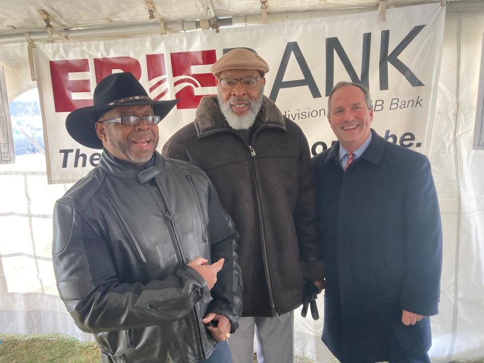 Bishop Dwane Brock, CEO of Erie's East Side Renaisance, at left, jokes with Erie City Councilman Melvin Witherspoon and Charles "Boo" Hagerty, president of Hamot Health Foundation. The three were among the speakers Thursday morning as ErieBank announced plans for a new neighborhood bank.