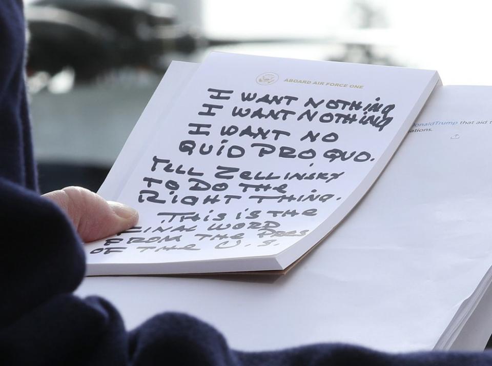 Trump's handwritten notes maintaining his innocence last week, during an address to reporters about the impeachment investigation | Mark Wilson/Getty