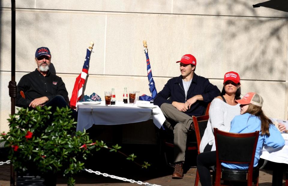 Supporters of U.S. President Donald Trump sit at a restaurant during the “Million MAGA March” from Freedom Plaza to the Supreme Court, on November 14, 2020 in Washington, DC. Supporters of U.S. President Donald Trump marching to protest the outcome of the 2020 presidential election. (Photo by Tasos Katopodis/Getty Images)