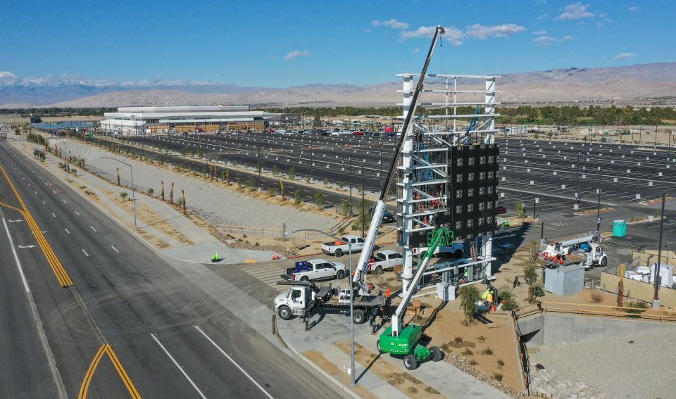 With just one day until the Acrisure Arena hosts its first ever event, construction continues on a large electronic sign and other construction at the arena in Palm Desert, California, Dec. 13, 2022.