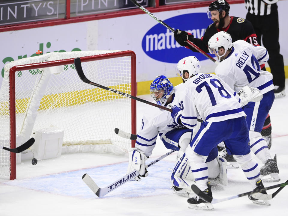 Ottawa Senators Derek Stepan, top right, cheers a goal by Chris Tierney, not seen, on Toronto Maple Leafs goaltender Frederik Andersen (31) during the second period of an NHL hockey game Friday, Jan. 15, 2021, in Ottawa, Ontario. (Sean Kilpatrick/The Canadian Press via AP)