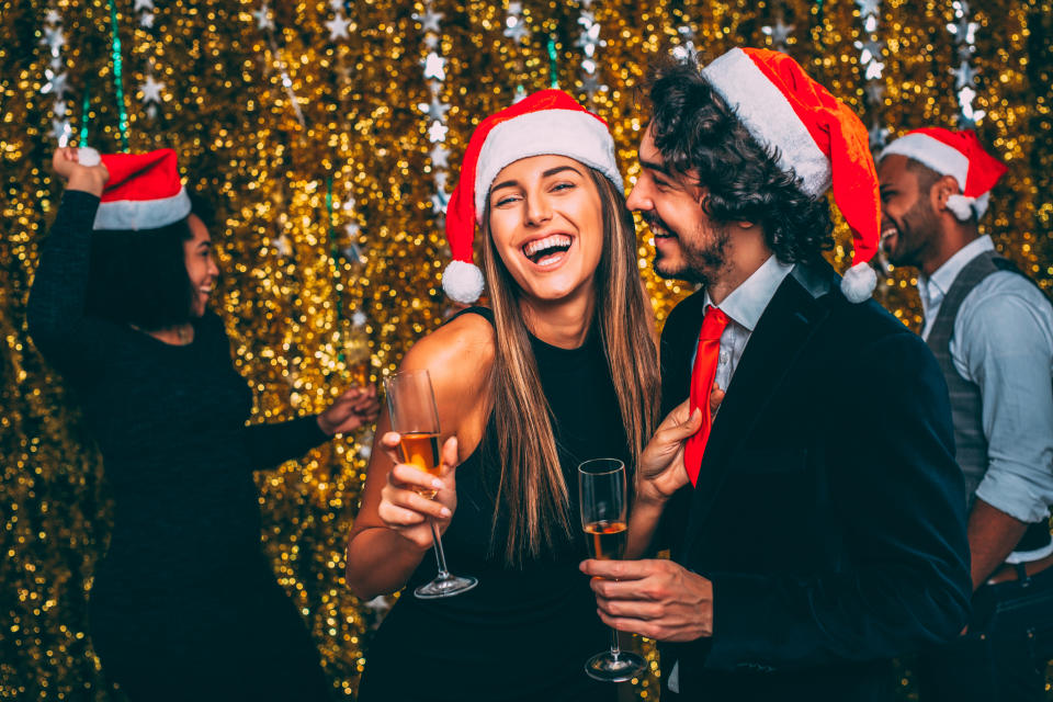 People enjoying a Christmas party. (Getty Images)