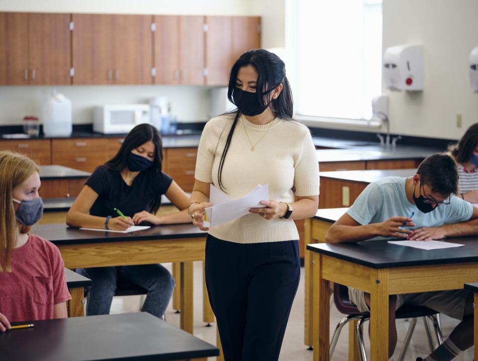 <span class="caption">Identity and race play significant factors in the first-year experiences of Latina teachers in the U.S.</span> <span class="attribution"><a class="link " href="https://www.gettyimages.com/detail/photo/high-school-teacher-and-students-in-classroom-royalty-free-image/1264702811?adppopup=true" rel="nofollow noopener" target="_blank" data-ylk="slk:RichLegg/E+ via Getty Images;elm:context_link;itc:0;sec:content-canvas">RichLegg/E+ via Getty Images</a></span>