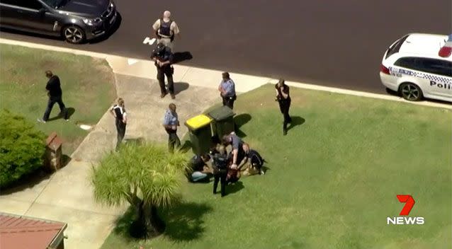 Pinned to the ground and under arrest, the alleged carjacker was caught in Koondoola. Source: 7 News