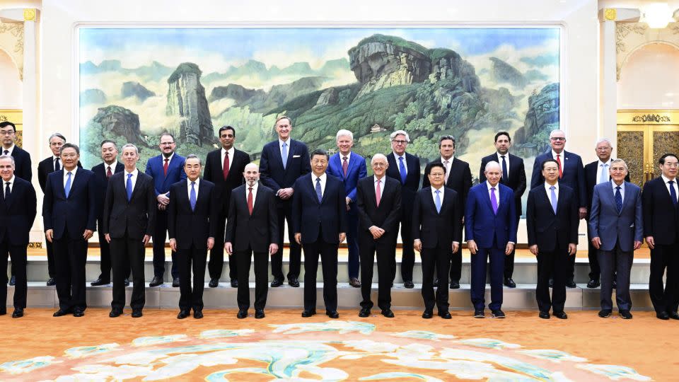 Xi and his American guests pose for a photo before the meeting. - Shen Hong/Xinhua/AP