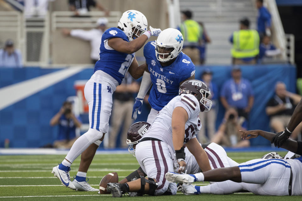 Kentucky linebacker Keaten Wade (20) and defensive lineman Deone Walker (0) celebrate a sack during the second half of an NCAA college football game in Lexington, Ky., Saturday, Sept. 9, 2023. (AP Photo/Michelle Haas Hutchins)