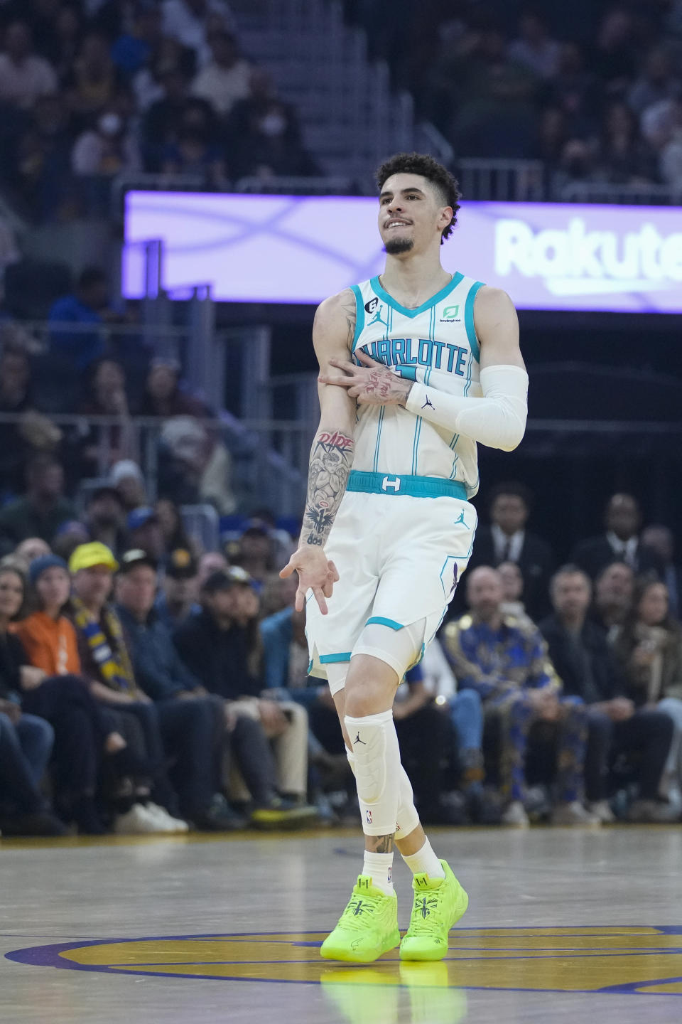 Charlotte Hornets guard LaMelo Ball reacts after scoring a 3-point basket against the Golden State Warriors during the first half of an NBA basketball game in San Francisco, Tuesday, Dec. 27, 2022. (AP Photo/Godofredo A. Vásquez)