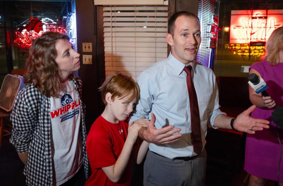 With his family by his side, Wichita mayor Brandon Whipple tells his supporters at Merle’s that things were not looking good after his opponent, Lily Wu, built a sizable lead against him. Whipple announced that he was headed home to get his young sons to bed.