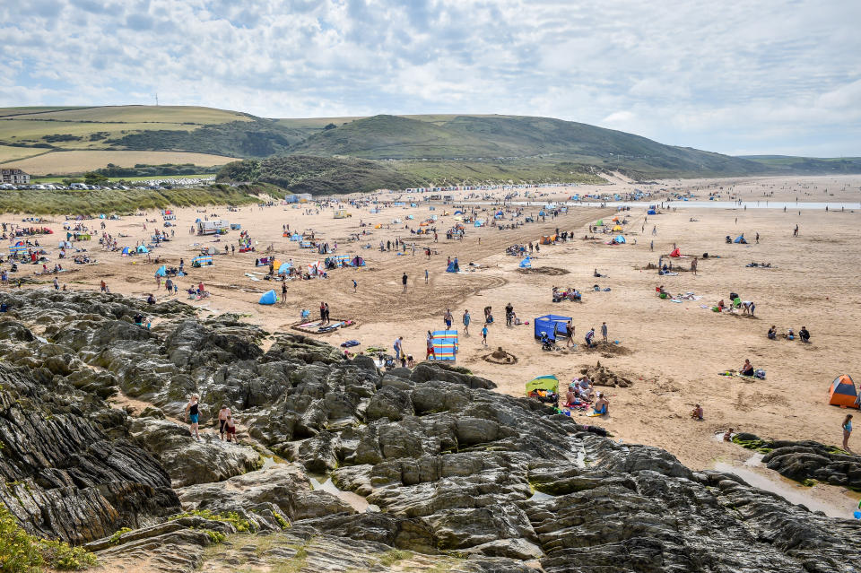 People flock to the sandy beach at Woolacombe, on the North Devonshire coast following the hottest August Bank Holiday Monday on record, with temperatures reaching 33.2C. The heatwave is set to continue for some parts of the UK after the record-breaking bank holiday weather.