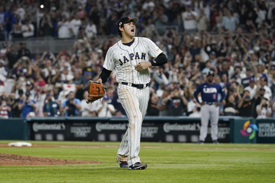 Japan pitcher Shohei Ohtani (16) celebrates after defeating the U.S. at the World Baseball Classic final game, Tuesday, March 21, 2023, in Miami. (AP Photo/Marta Lavandier)