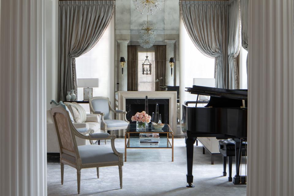 In a Lincoln Park Georgian home designed by Tom Stringer, old and new mingle in the living room, which pairs contemporary-city furniture with 19th-century French neoclassical pieces, all set against a light, simple palette.