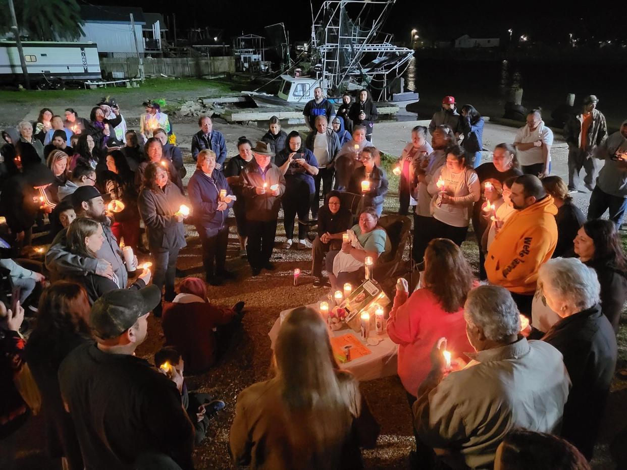 Friends, family and supporters gather Monday evening, Feb. 13, 2023, for a vigil in honor of Thomas Phillips of Dulac, a tugboat deckhand who went missing last week in the Gulf of Mexico.