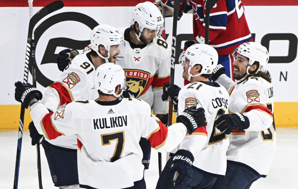 Florida Panthers' Oliver Ekman-Larsson (91) celebrates with teammates after scoring against the Montreal Canadiens during the third period of an NHL hockey game in Montreal, Thursday, Nov. 30, 2023. (Graham Hughes/The Canadian Press via AP)