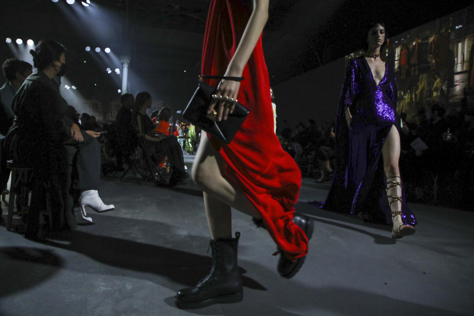 Models wear creations for the Valentino Spring-Summer 2022 ready-to-wear fashion show presented in Paris, Friday, Oct. 1, 2021. (Photo by Vianney Le Caer/Invision/AP)