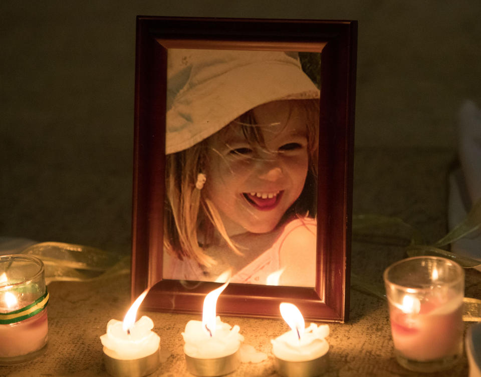 Candles are placed next to a photo of Madeleine McCann inside the Church of Nossa Senhora da Luz in Praia Da Luz, Portugal, where a special service was held to mark the 10th anniversary of her disappearance.