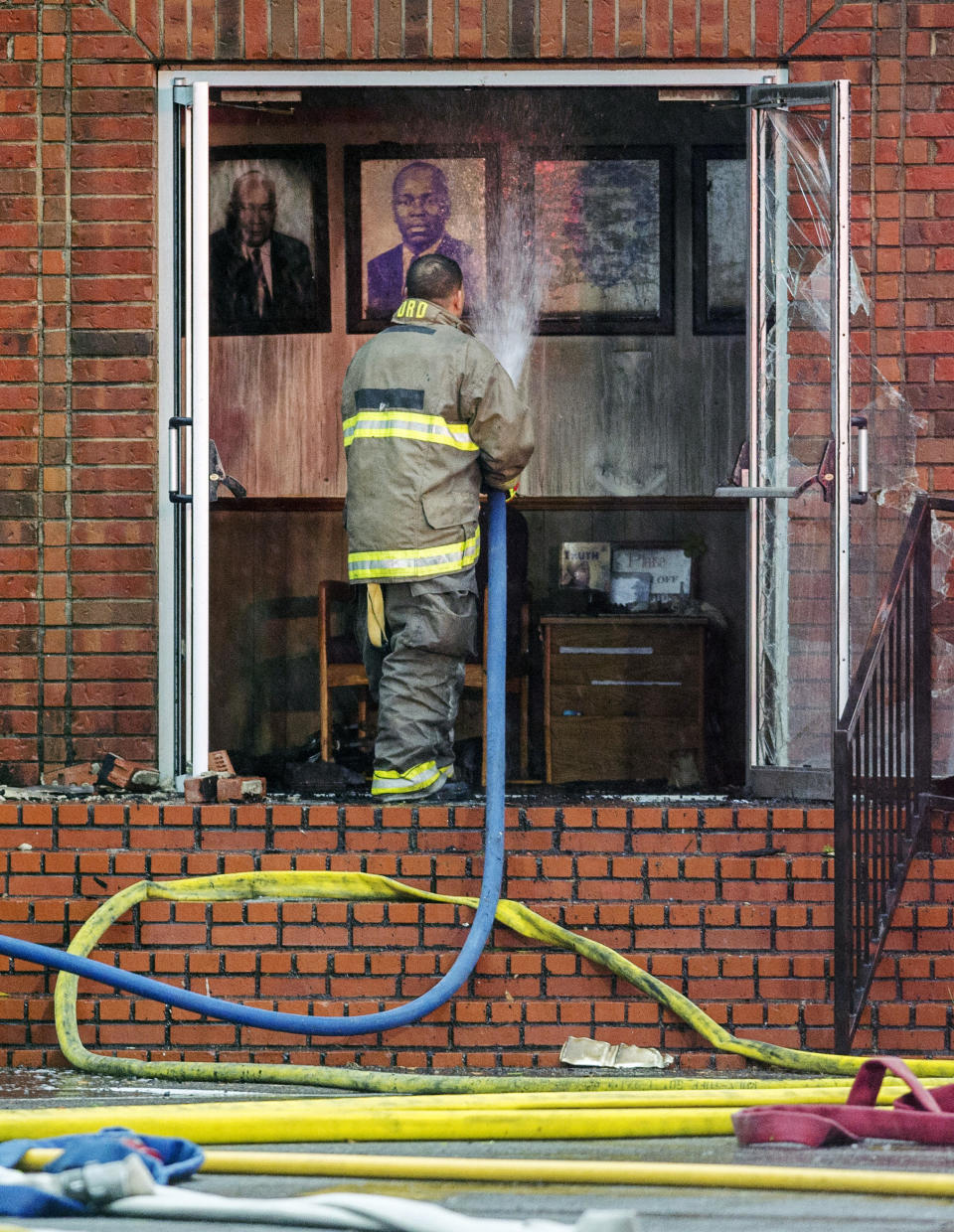 Firefighters and fire investigators respond to a fire at Mt. Pleasant Baptist Church Thursday, April 4, 2019, in Opelousas, La. Authorities in southern Louisiana are investigating a string of "suspicious" fires at three African American churches in recent days. Fire Marshal H. "Butch" Browning said it wasn't clear whether the fires in St. Landry Parish are connected and he declined to get into specifics of what the investigation had yielded so far but described the blazes as "suspicious." (Leslie Westbrook/The Advocate via AP)