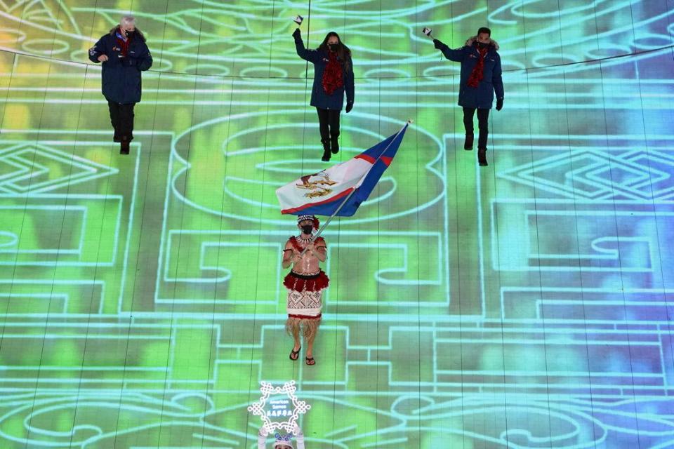 Nathan Crumpton, of American Samoa, arrives during the opening ceremony of the 2022 Winter Olympics, Friday, Feb. 4, 2022, in Beijing. (AP Photo/Ashley Landis)