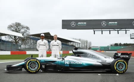 Britain Formula One - F1 - 2017 Mercedes Formula One Car Launch - Silverstone - 23/2/17 Mercedes' Lewis Hamilton and Valtteri Bottas pose during the launch Reuters / Eddie Keogh Livepic