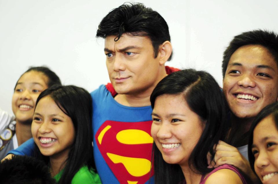 Fans flock "Superman" during the Cosplay Mania 2012 held at the SMX Convention Center in Pasay City, Metro Manila on 29 September 2012. (Angela Galia/NPPA images)