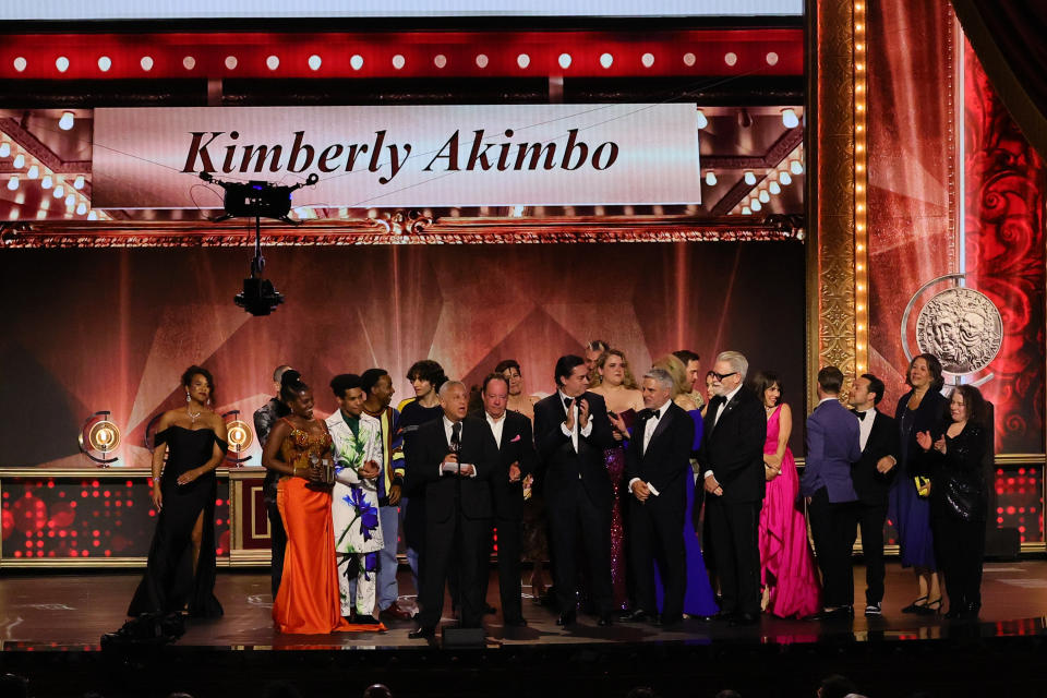A group gathers while David Stone accepts the award for Best Musical for "Kimberly Akimbo."