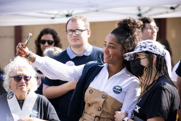 PHOTO: Canvassers take a selfie photograph during an election day campaign event for Sen. Raphael Warnock, Nov. 8, 2022 in Atlanta. (Dustin Chambers/Bloomberg via Getty Images)