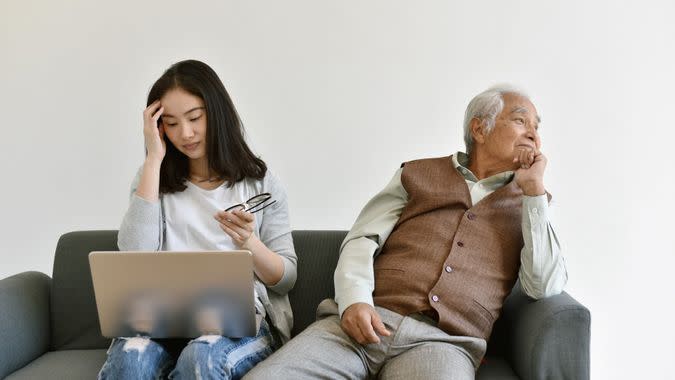 Social isolation problem in retiree citizen, Asian daughter focus on hard working and ignore loneliness elderly old father, Family relationship conflict, Senior mental health problem concept.