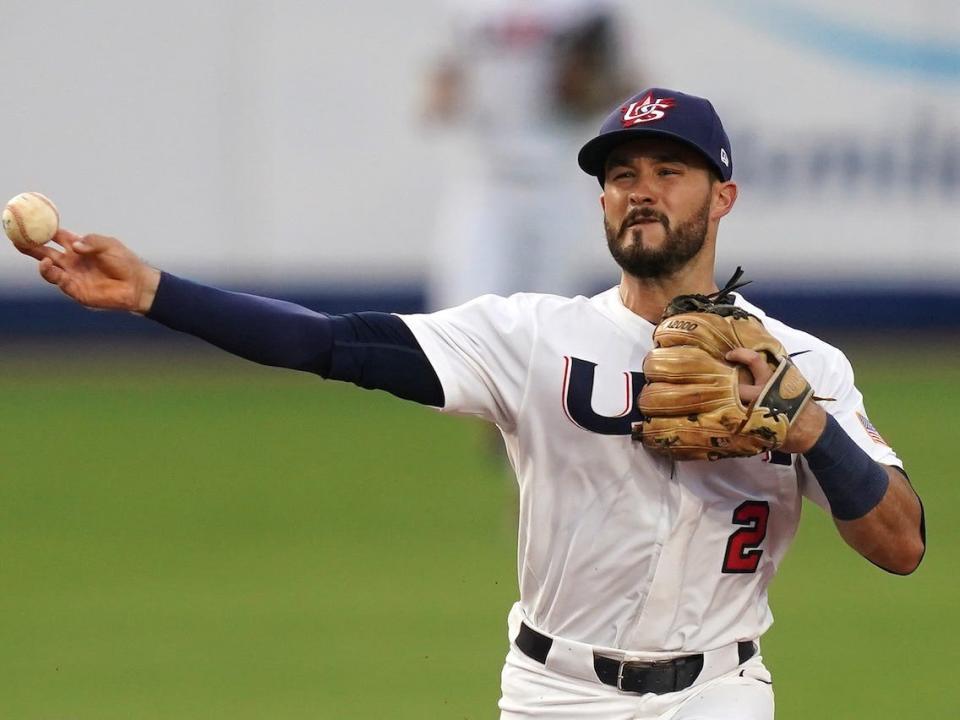 USA Baseball's Eddy Alvarez throws from second base.