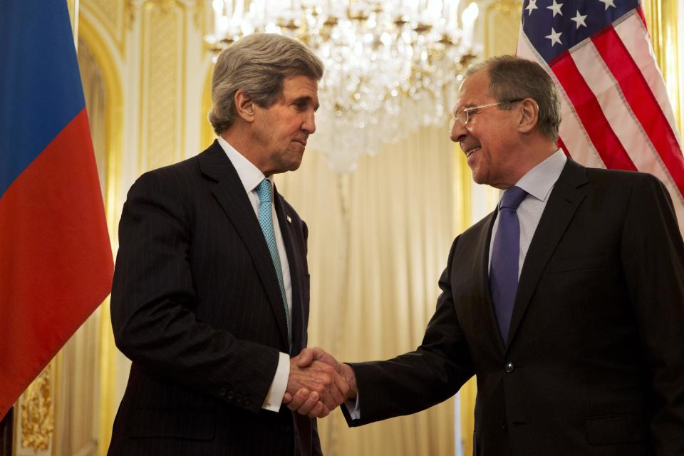 U.S. Secretary of State John Kerry, left, shakes hands with Russian Foreign Minister Sergey Lavrov before the start of their meeting at the Russian Ambassador's residence about the situation in Ukraine, in Paris Sunday March 30, 2014. Kerry traveled to Paris for a last minute meeting with Lavrov. (AP Photo/Jacquelyn Martin, Pool)