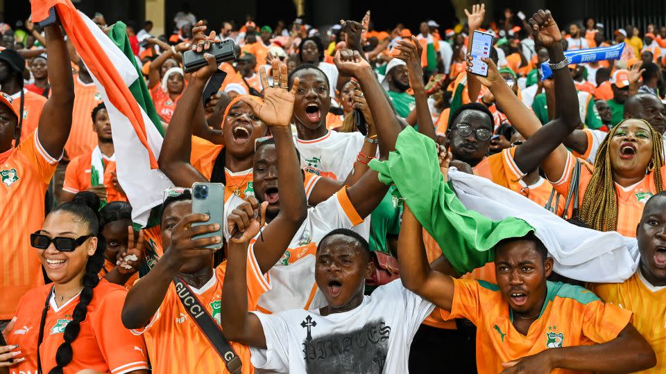 Ivory Coast's supporters celebrate their victory at the end of the match. - Sia Kambou/AFP/Getty Images