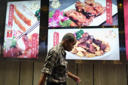 Lou Tit-Man, 73, walks in Mong Kok in Hong Kong