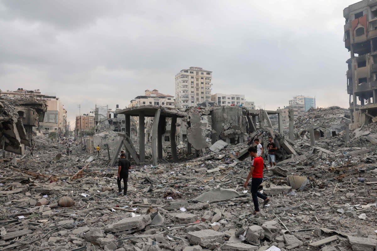 Palestinians inspect the destruction from Israeli airstrike in Gaza (AFP via Getty Images)