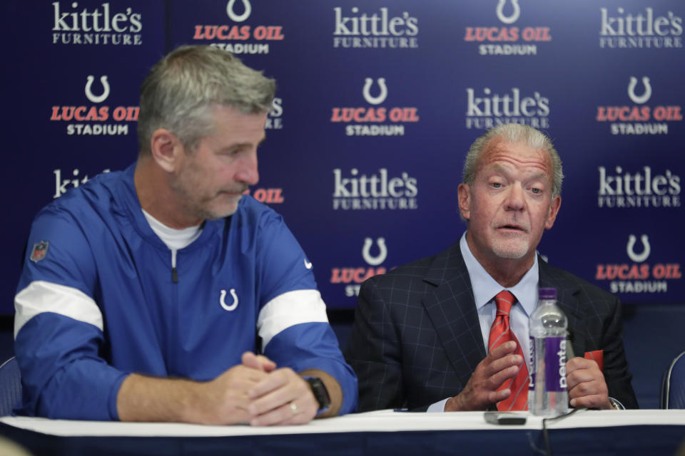 Indianapolis Colts coach Frank Reich listens as team owner Jim Irsay speaks