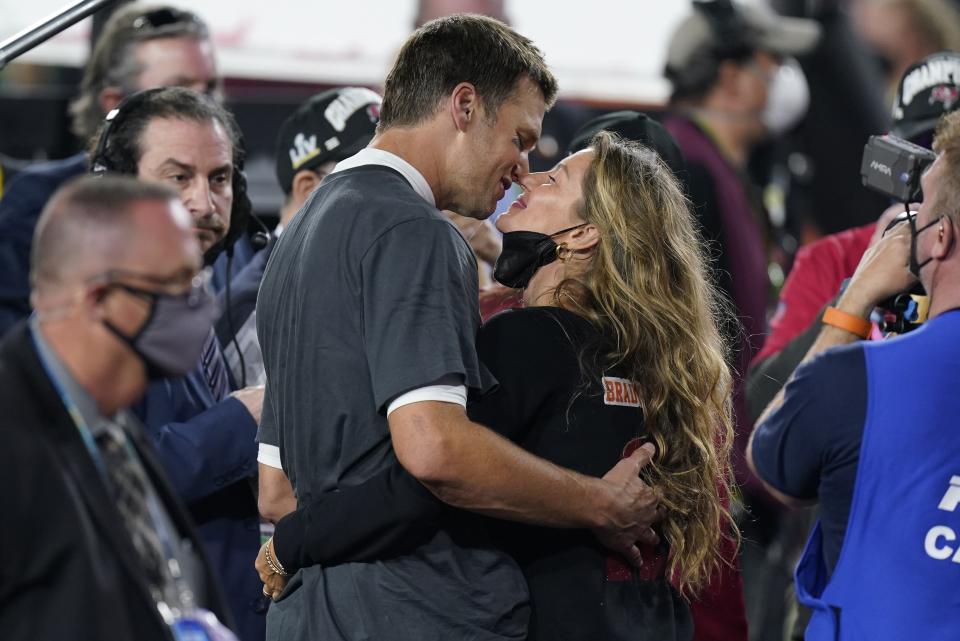 Tampa Bay Buccaneers quarterback Tom Brady kisses wife Gisele Bundchen after defeating the Kansas City Chiefs in the NFL Super Bowl 55 football game Sunday, Feb. 7, 2021, in Tampa, Fla. (AP Photo/Mark Humphrey)