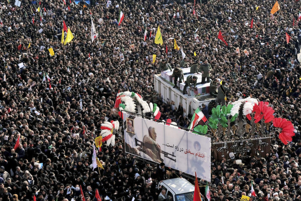 Coffins of Gen. Qassem Soleimani and others who were killed in Iraq by a U.S. drone strike are carried on a truck surrounded by mourners during a funeral procession, at the Enqelab-e-Eslami (Islamic Revolution) square in Tehran, Iran, Monday, Jan. 6, 2020. The processions mark the first time Iran honored a single man with a multi-city ceremony. Not even Ayatollah Ruhollah Khomeini, who founded the Islamic Republic, received such a processional with his death in 1989. Soleimani on Monday will lie in state at Tehran's famed Musalla mosque as the revolutionary leader did before him. (AP Photo/Ebrahim Noroozi)