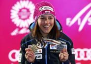 Alpine Skiing - FIS Alpine Skiing World Championships - Women's Slalom - St. Moritz, Switzerland - 18/2/17 - Wendy Holdener of Switzerland poses with her gold and silver medals. REUTERS/Ruben Sprich