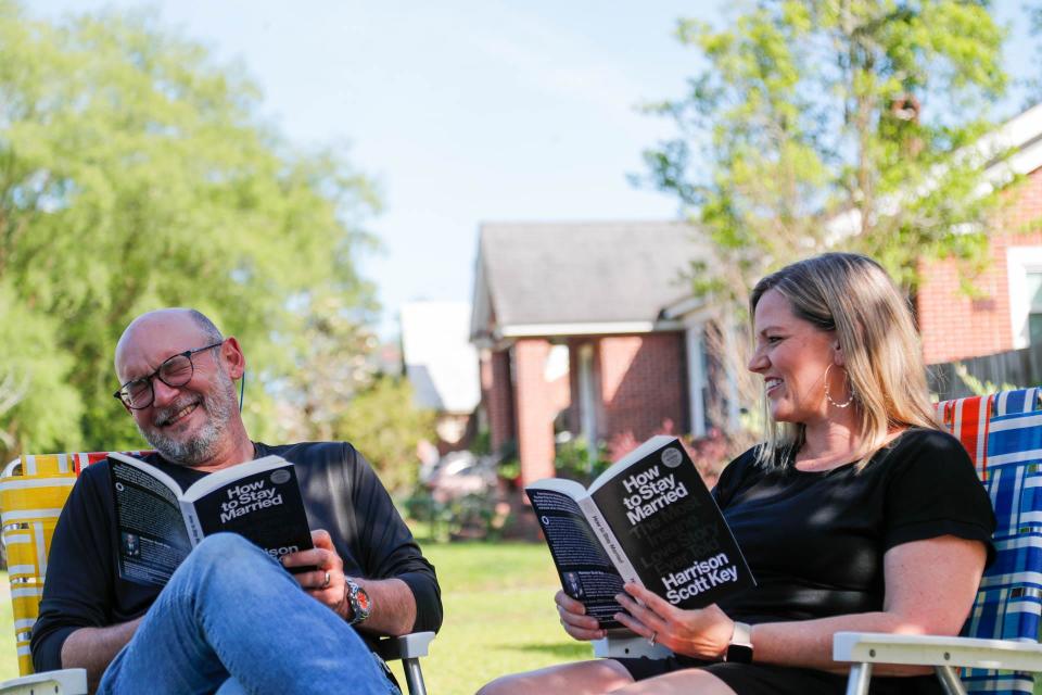 Harrison and Lauren Key share a laugh together in the front yard of their Savannah home.