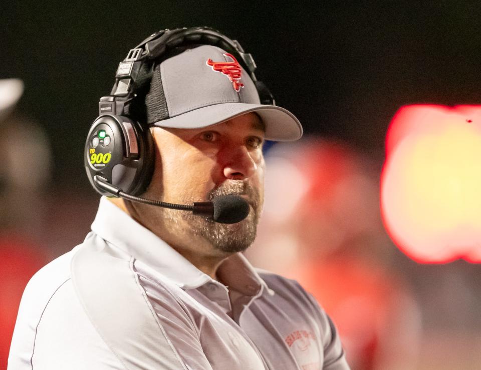 Bradford head coach Jamie Rodgers talks to the offense during a timeout against Lecanto.