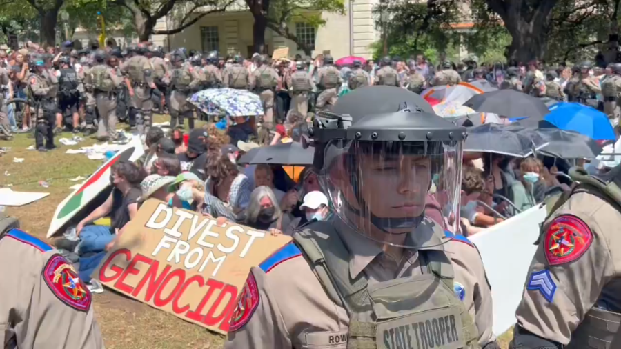 Group of pro-Palestine protesters hunker down in the middle of law enforcement circle on the campus of the University of Texas at Austin on Monday, April 29, 2024. (KXAN Photo/Grace Reader)