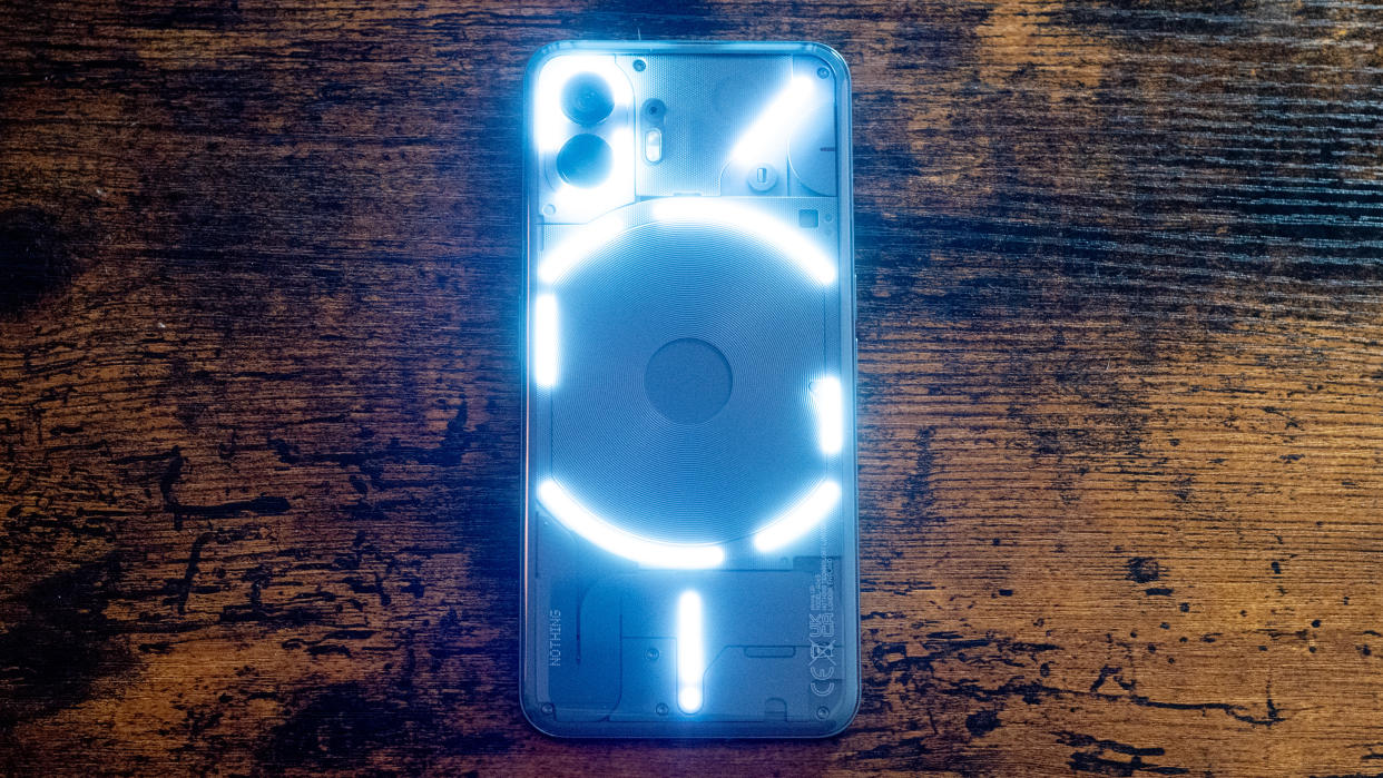  Nothing Phone 2 showing screen and lit glyph LED lights 