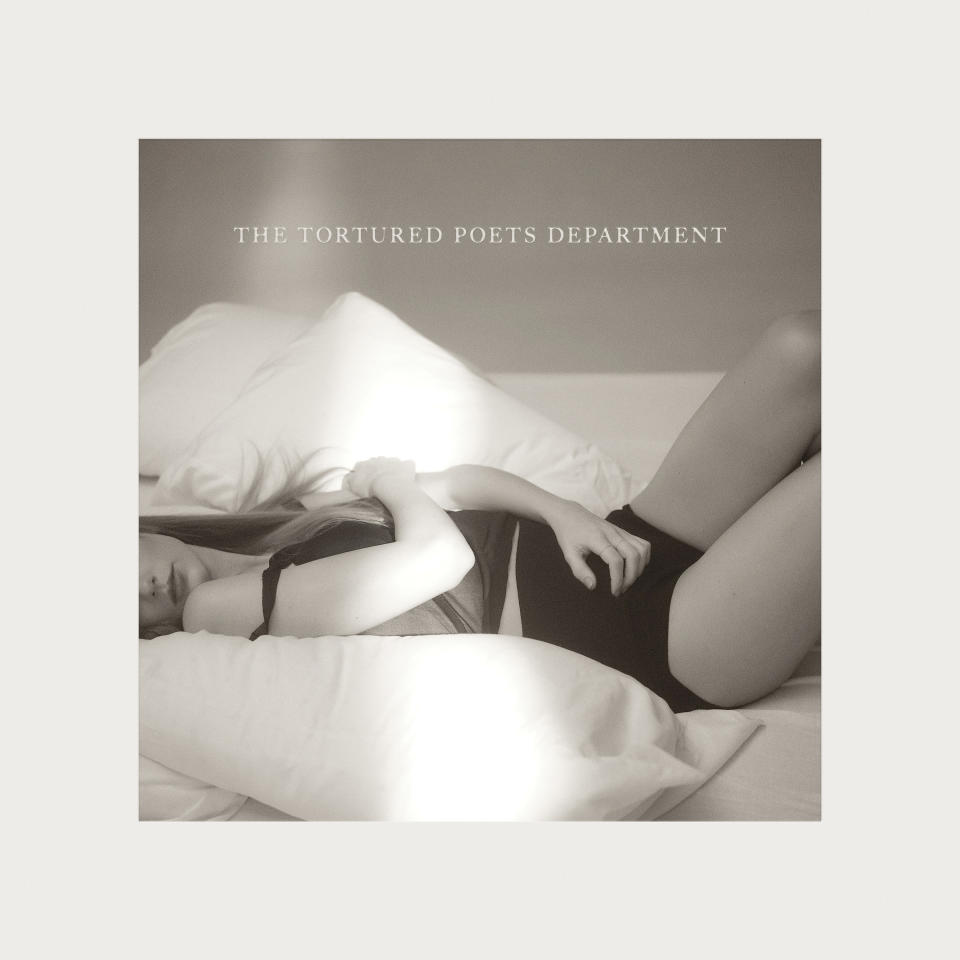 Album cover of 'The Tortured Poets Department' with an Taylor Swift posing pensively on a bed