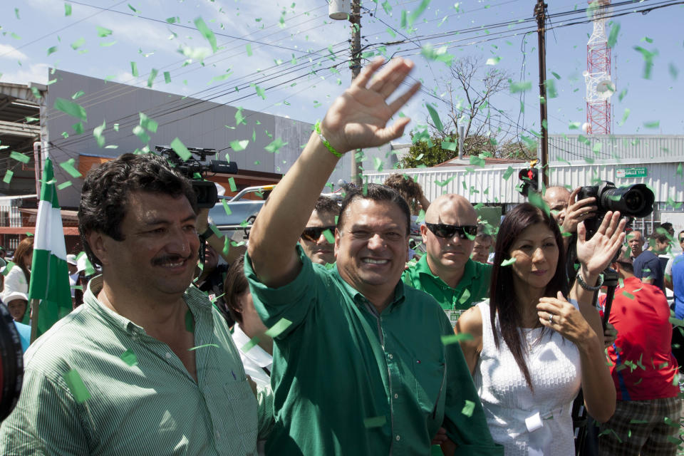 Johnny Araya, presidential candidate for the National Liberation Party, PLN, waves to supporters outside a polling station, after voting in the general election in San Jose, Costa Rica, Sunday, Feb. 2, 2014. The ruling PLN has been beset by infighting and corruption allegations and Araya, now faces three rivals, which experts say could splinter Sunday's vote. Araya, who has been the mayor of the capital of San Jose since 2003, must overcome the discontent over high unemployment during President Laura Chinchilla's government. (AP Photo/Moises Castillo)