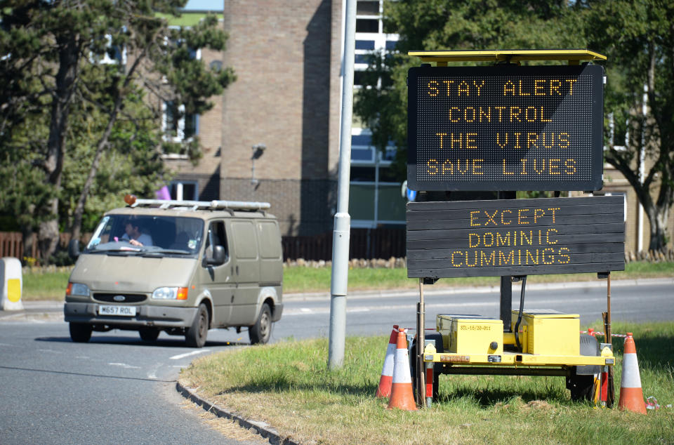 BRIDPORT, ENGLAND - MAY 27: A road sign stating 'Stay Alert, Control the Virus, Save Lives' has an additional sign added by members of the public stating 'Except Dominic Cummings' on May 27, 2020 in Bridport, United Kingdom. The British government continues to ease the coronavirus lockdown by announcing schools will open to reception year pupils plus years one and six from June 1st. Open-air markets and car showrooms can also open from the same date.  (Photo by Finnbarr Webster/Getty Images)