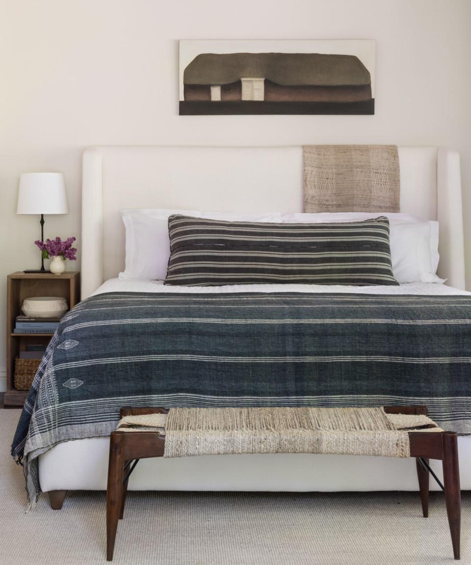 bedroom with black striped throw and pillow