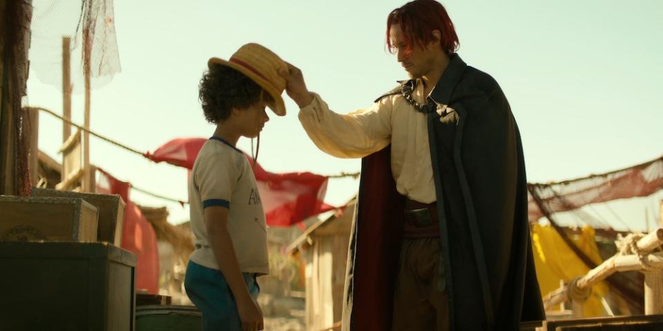 One Piece. (L to R) Colton Osorio as Young Luffy, Peter Gadiot as Shanks in season 1 of One Piece. Cr. Courtesy of Netflix © 2023