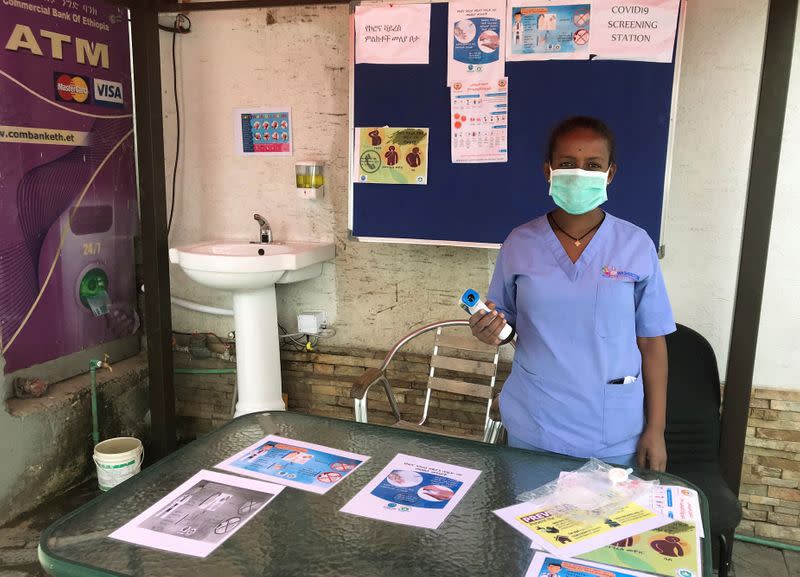 FILE PHOTO: An Ethiopian health worker stands at a testing station amid concerns about the spread of coronavirus disease (COVID-19) in Addis Ababa