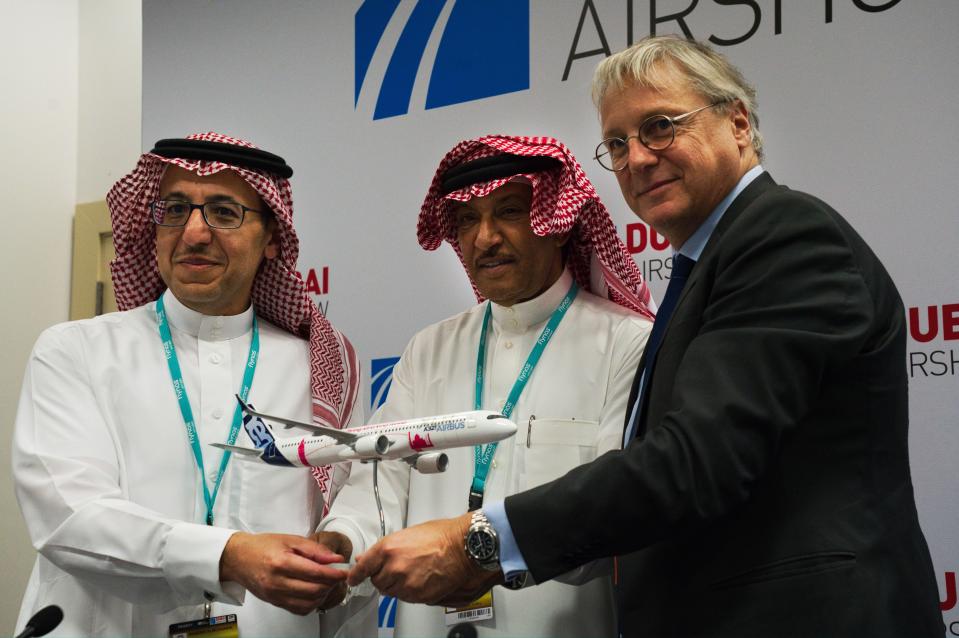 Flynas CEO Bander al-Mohanna, left, flynas chairman Ayed Thawab al-Jeaid, center, and Airbus' chief commercial officer Christian Scherer pose during a news conference at the Dubai Airshow in Dubai, United Arab Emirates, Tuesday, Nov. 19, 2019. Saudi budget carrier flynas announced a firm order Tuesday of 10 Airbus A321XLR, a deal valued at $1.4 billion at list price. (AP Photo/Jon Gambrell)