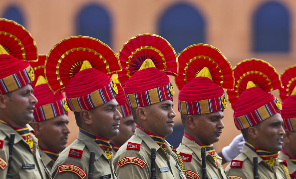 Indian Sashastra Seema Bal personnel take part in the Independence Day celebration parade in Gauhati, India, Thursday, Aug. 15, 2019. Indian Prime Minister Narendra Modi defended his government's controversial measure to strip the disputed Kashmir region of its statehood and special constitutional provisions in an Independence Day speech Thursday, as about 4 million Kashmiris stayed indoors for the 11th day of an unprecedented security lockdown and communications blackout. (AP Photo/Anupam Nath)